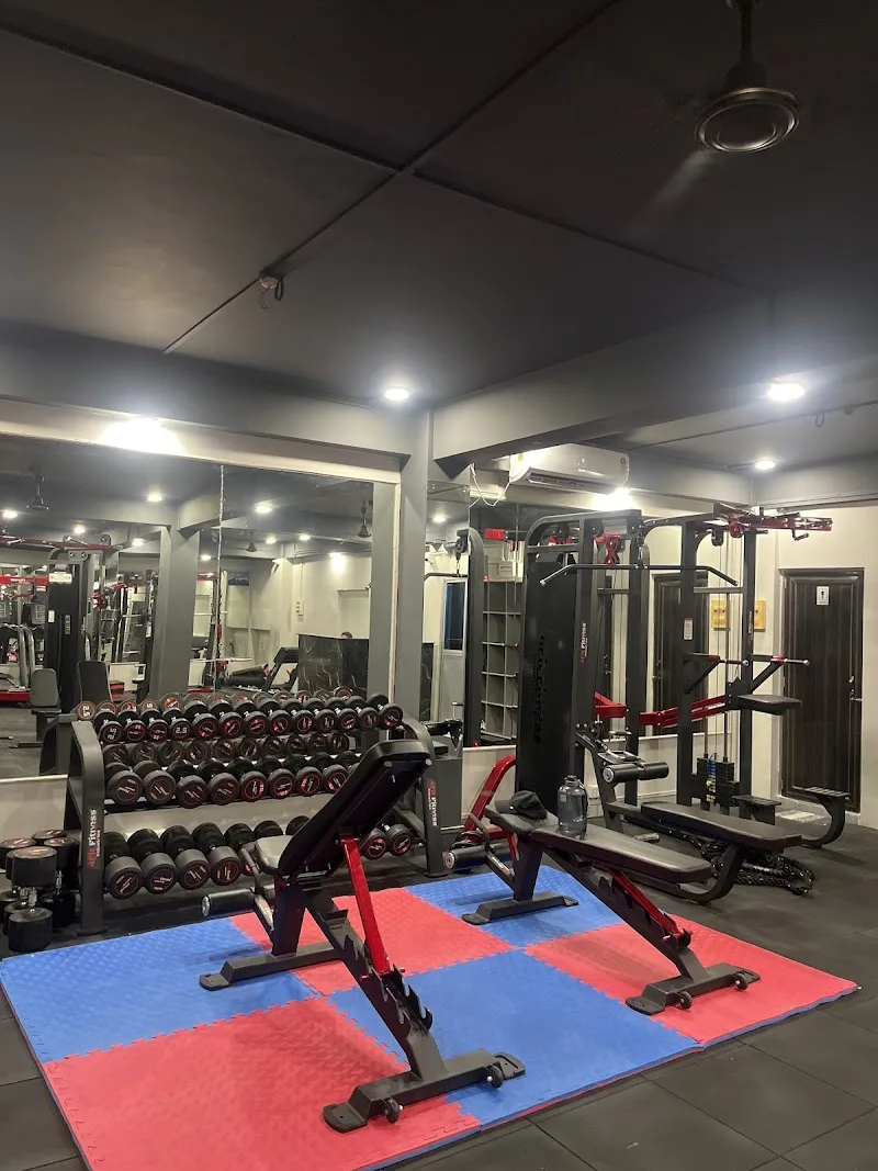 ALTR Fitness Club strength floor with cable machine, bench and dumbbells